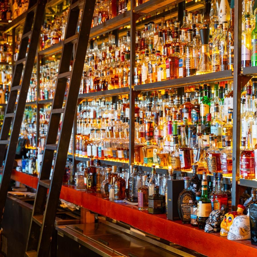 a bar with many bottles of alcohol