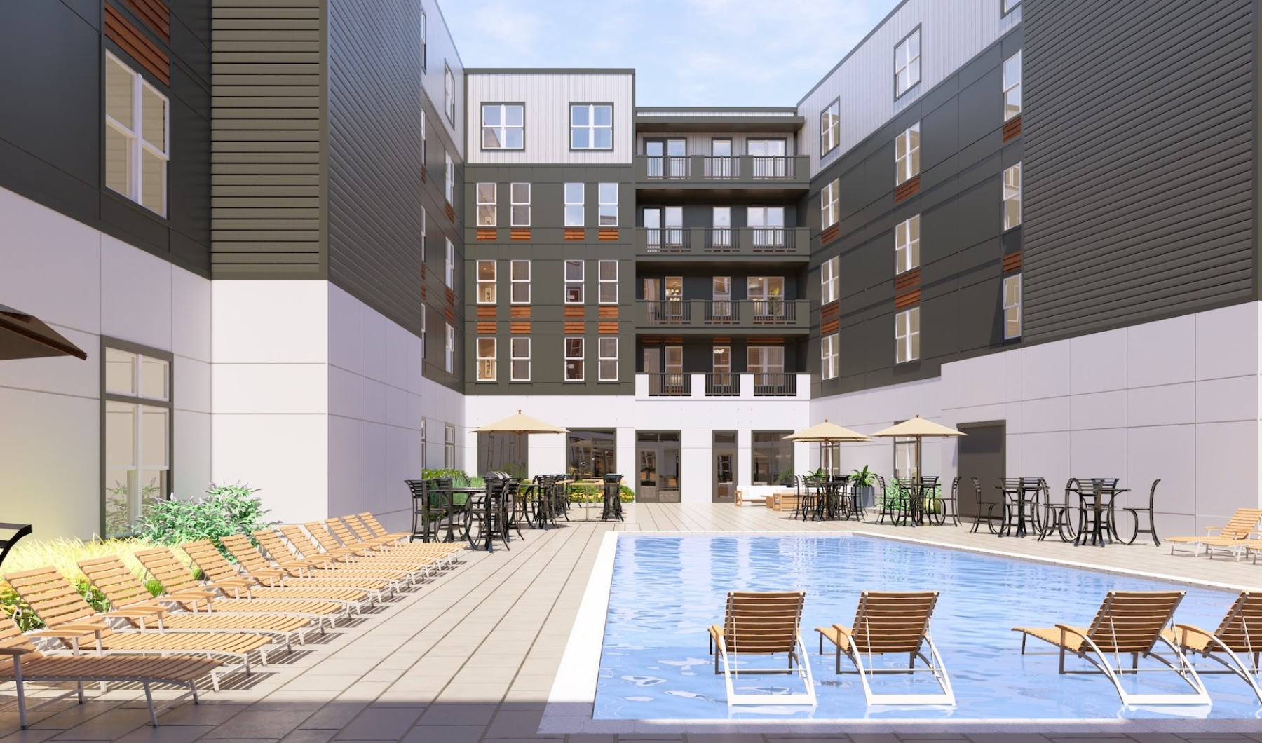 a swimming pool with lounge chairs